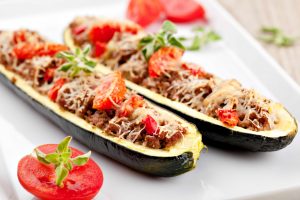 Zucchini halves stuffed with minced meat and vegetable