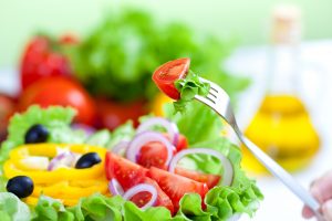 healthy fresh vegetable salad and fork