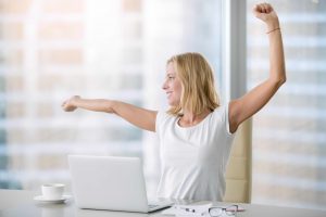 Young attractive woman at modern office desk, with laptop, stretching, getting a little exercise during the day, office workout, completing difficult task, time for lunch. Business concept illustration