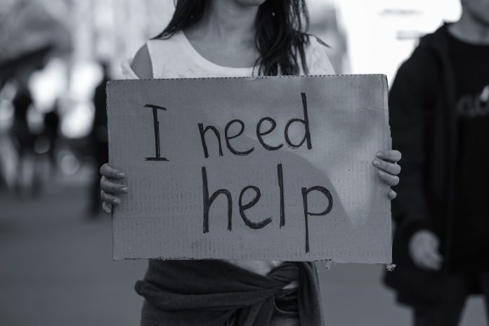 Poor woman begging for help on the street